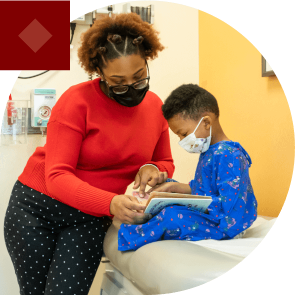 Young boy and his mom reading